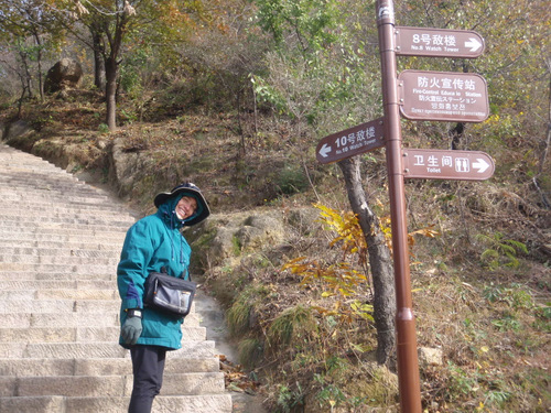 Terry Struck stands by some trails signs.